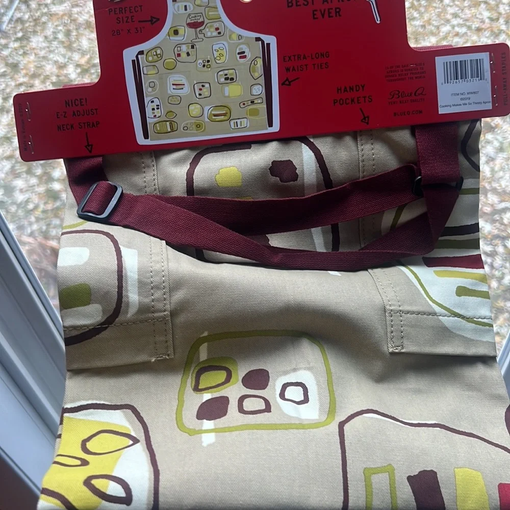 NWT Blue Q apron. “Cooking makes me so thirsty” featuring wine glasses.